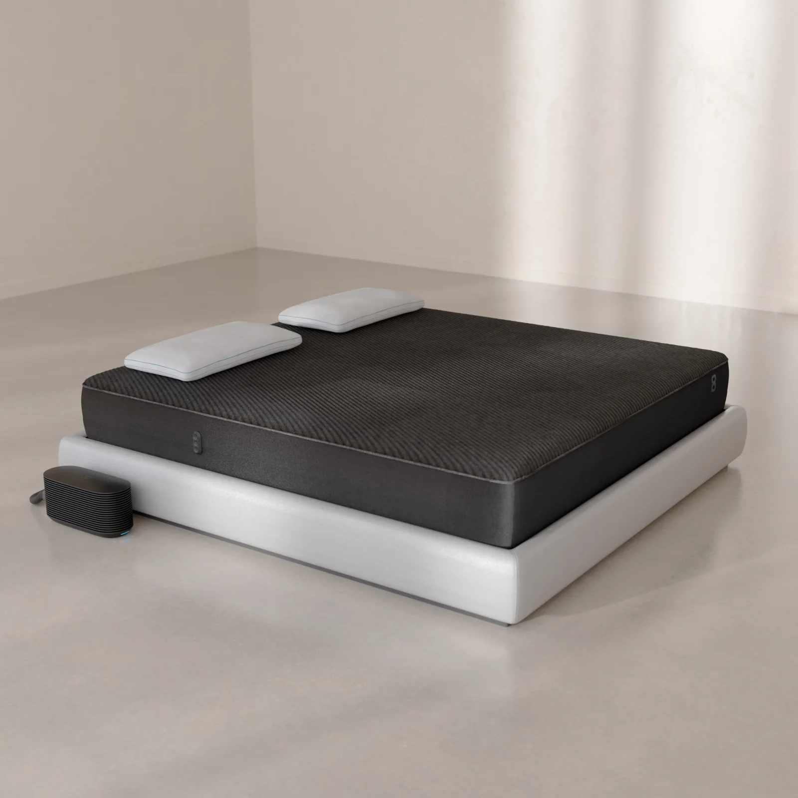 Eight Sleep Pod 6 Cover rolled beside its compact Hub on a white bed